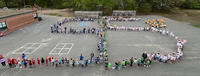Students show their school pride by lining up in the shape of "SLS" for Shaker Lane School during "Picture This Day" on May 8.